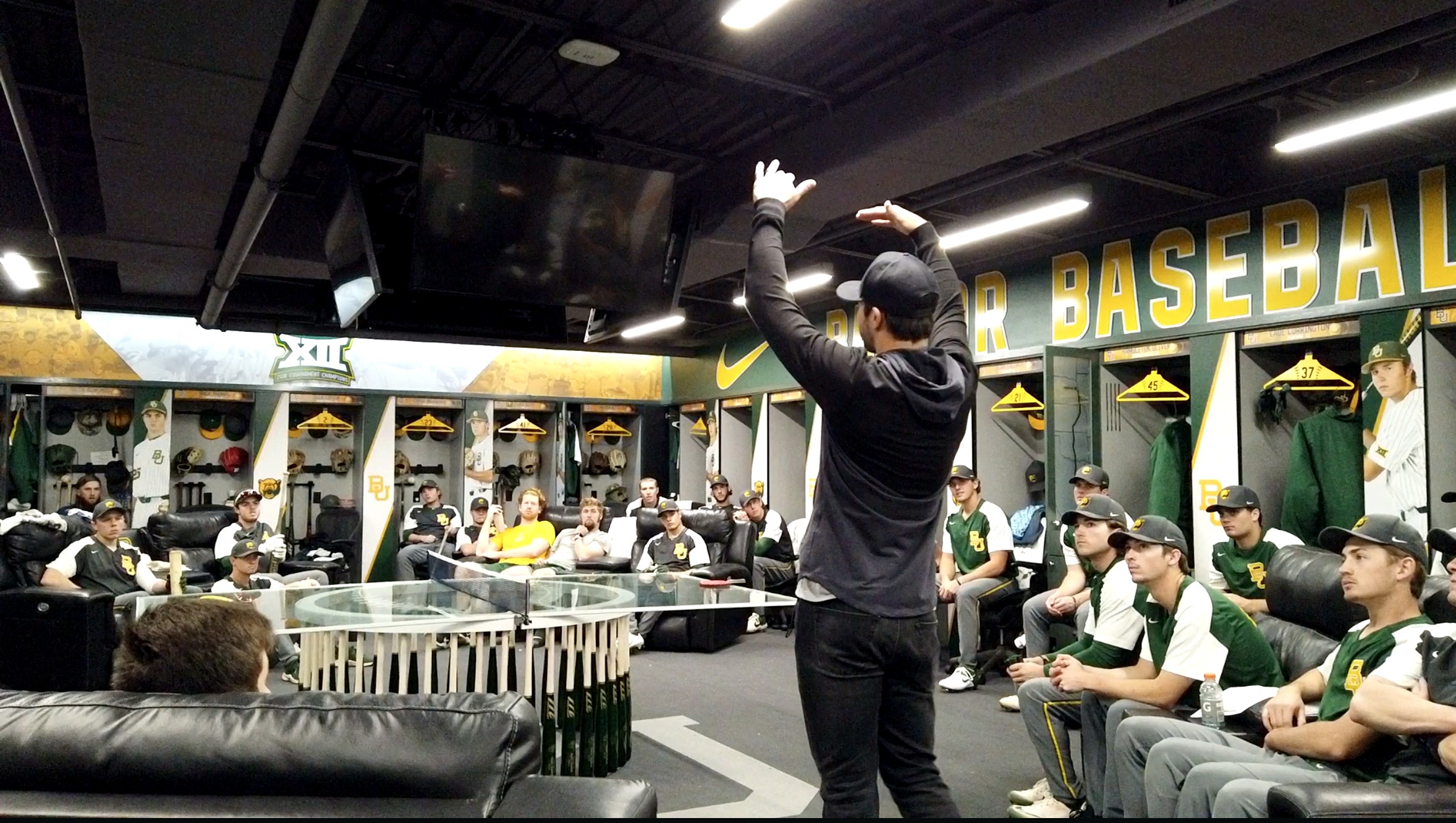 Chase d'Arnaud speaks with Baylor University baseball players inside the team lounge.