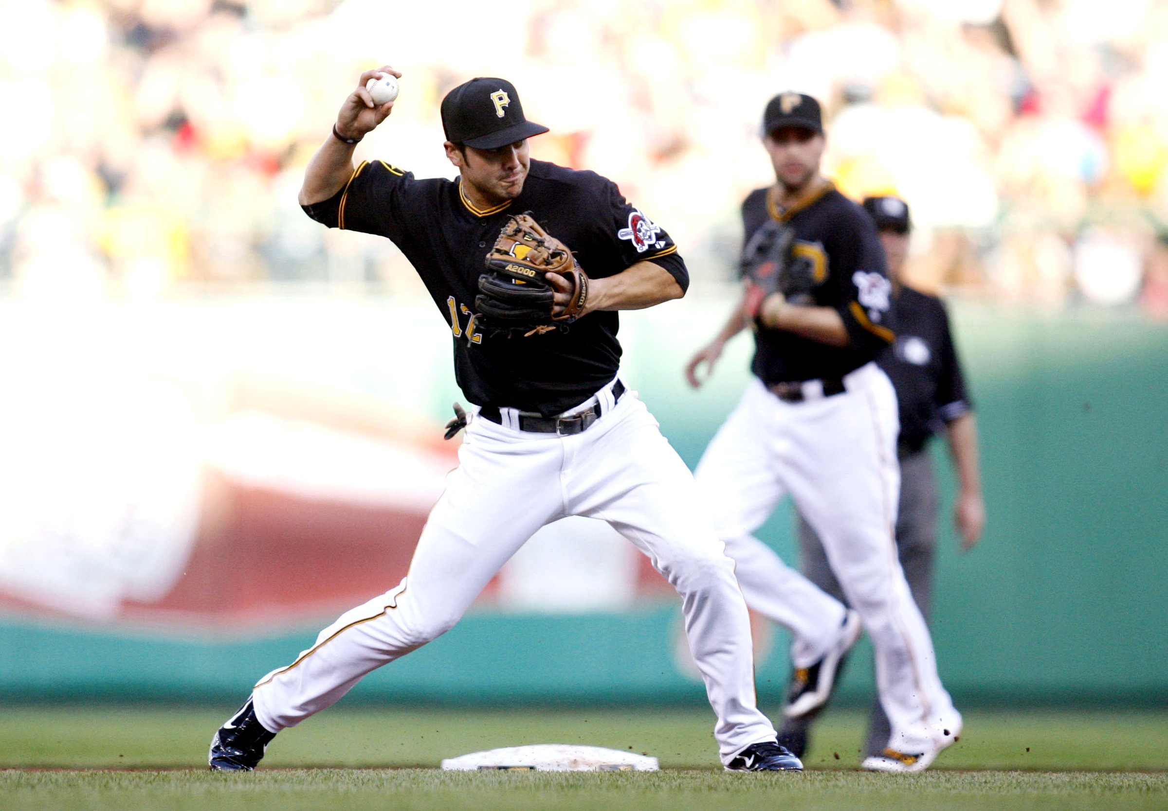 Chase d'Arnaud makes a throw from second base for the Pittsburgh Pirates.