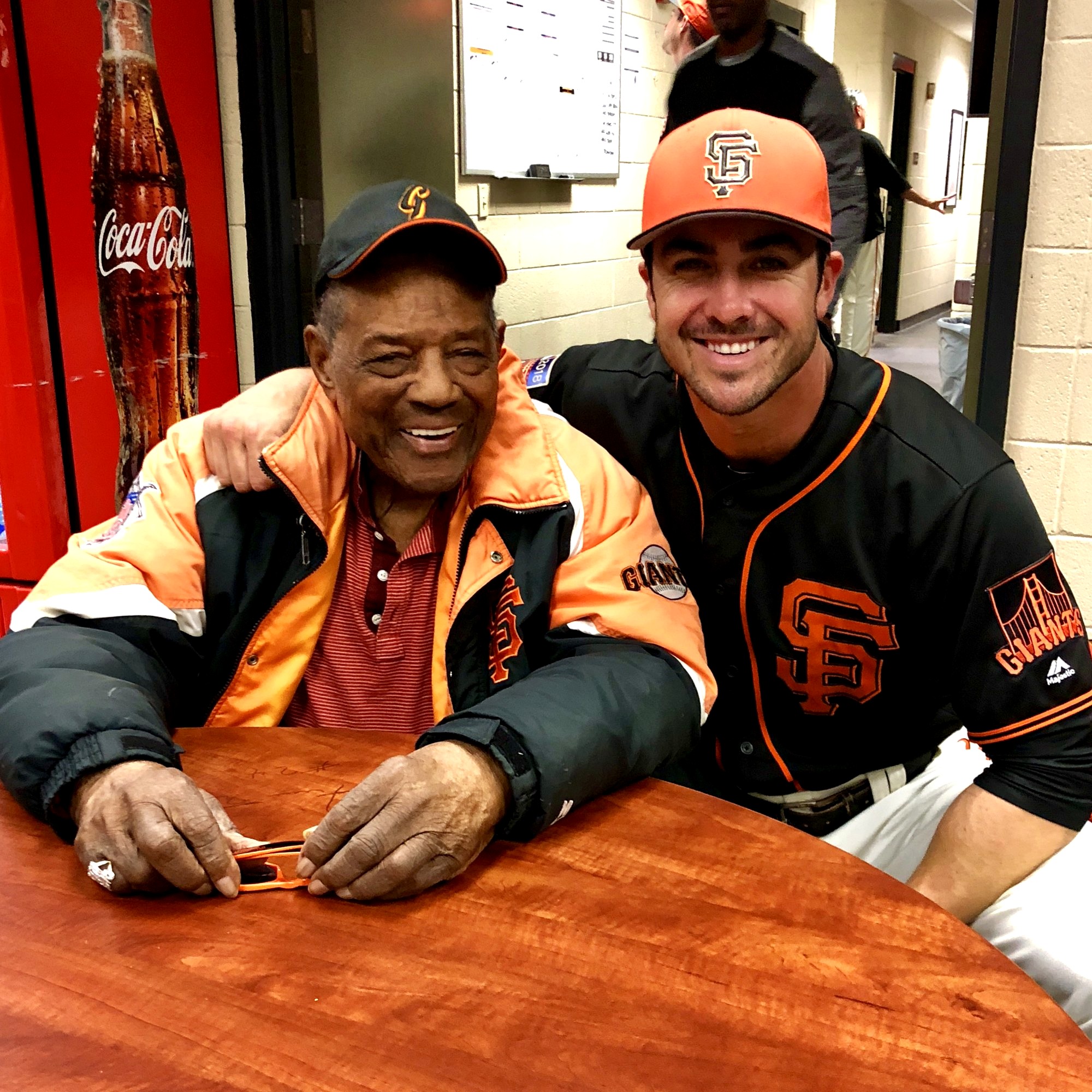 Chase d'Arnaud with Willie Mays in the San Francisco Giants clubhouse.